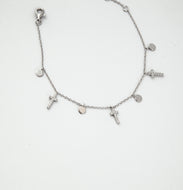 Pulseira em prata 925 com banho de ródio, cruz em Zirconias e bolinha lisa